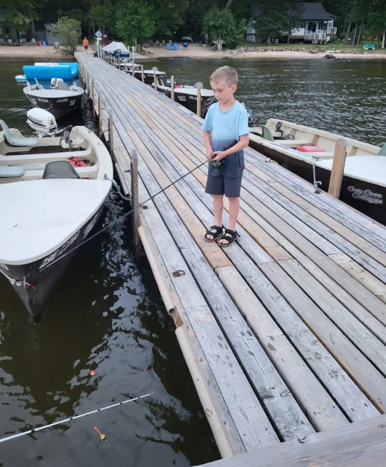 Boy fishing from the dock